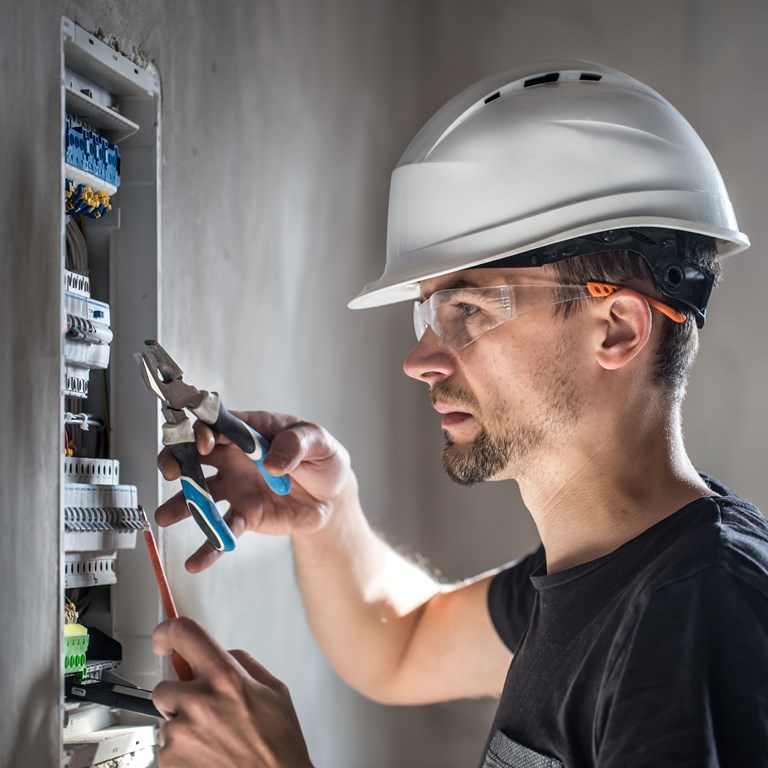 28 Man Electrical Technician Working Switchboard With Fuses Installation Connection Electrical Equipment